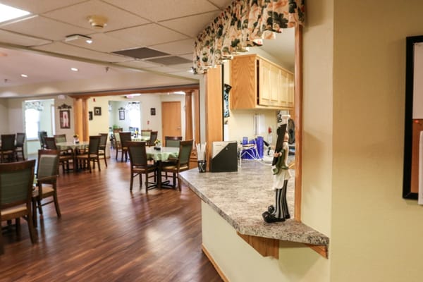 Dining area with wooden tables and chairs