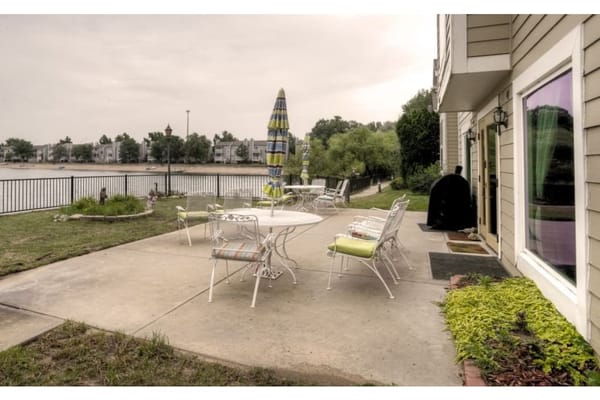 Outdoor patio with a view of the water and seating
