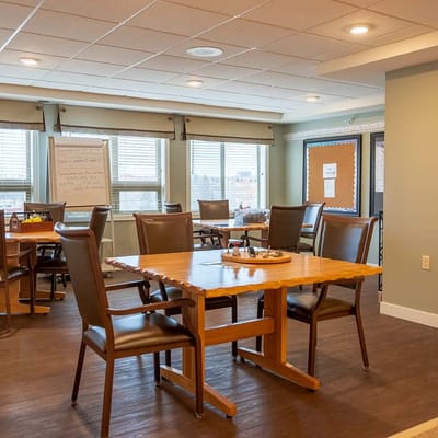 Bright common area with dining table and chairs