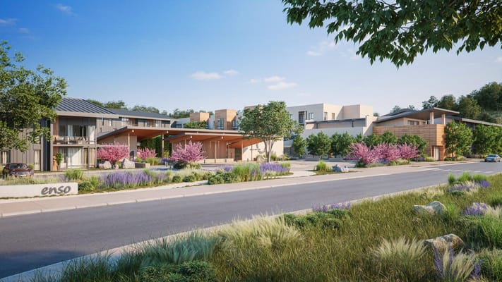 Exterior view of Enso Village with blooming landscaping