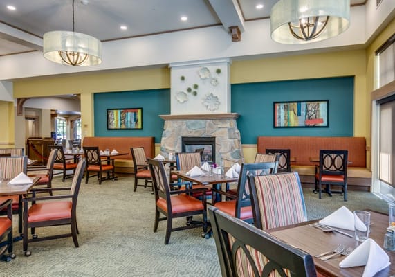 Interior dining room with tables and chairs set up