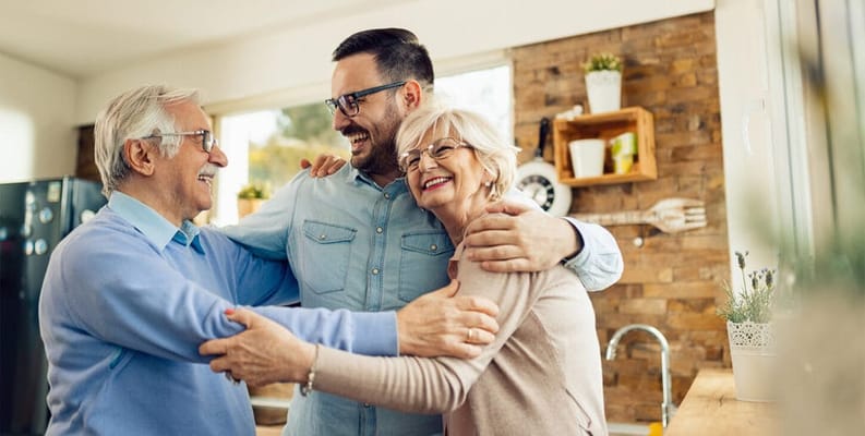 Residents enjoying a warm moment together in the activity room