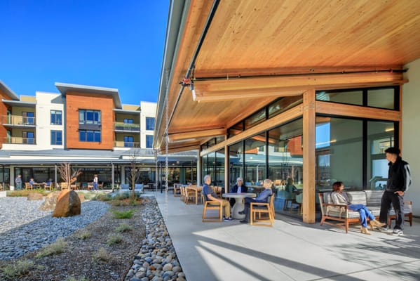 Outdoor seating area of Enso Village with residents