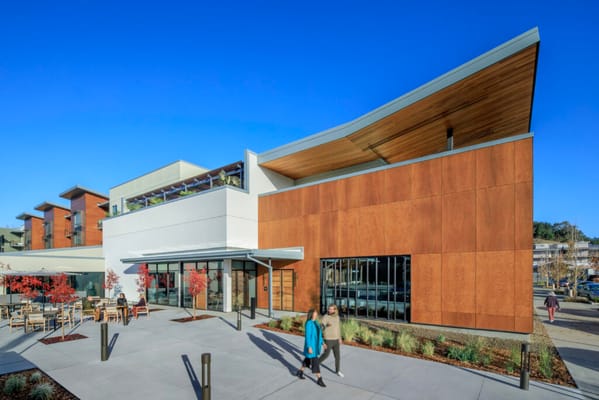 Exterior view of Enso Village with people walking
