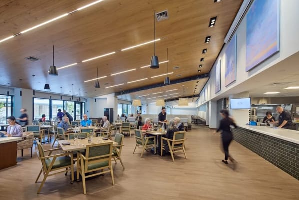 Residents enjoying meals in a dining area