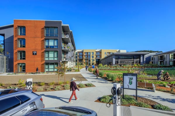 Residents and staff in a well-designed outdoor space at Enso Village