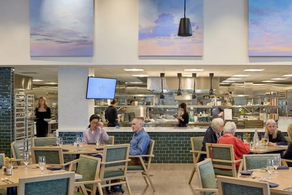 Residents enjoying a meal in a bright dining room