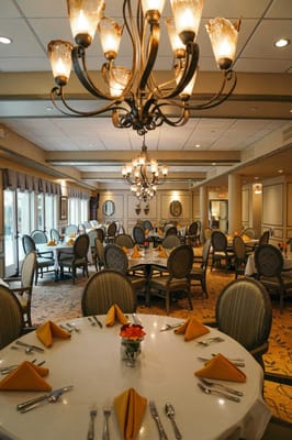Elegant dining room with tables set for a meal