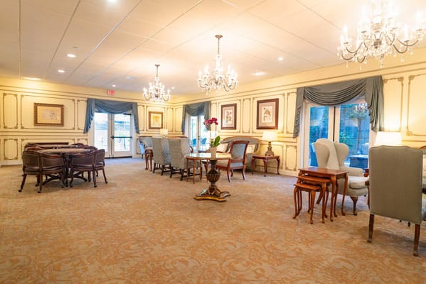 Interior common area with seating and chandeliers