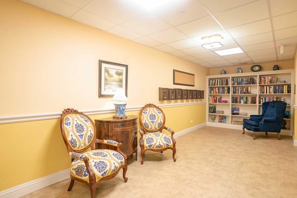 Bright common area with seating and bookshelves