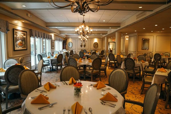 Elegant dining room with tables set for a meal