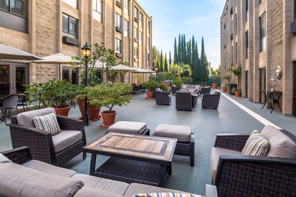 Outdoor courtyard with seating and greenery
