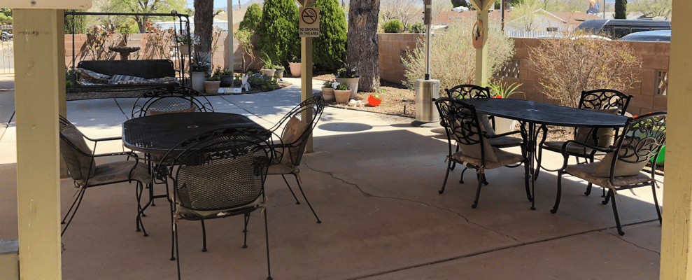 Outdoor patio area with tables and chairs