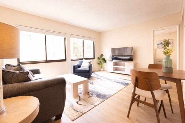 Bright and airy common area with furniture