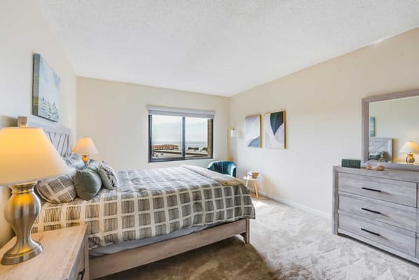 Bright resident room with a sea view and modern decor