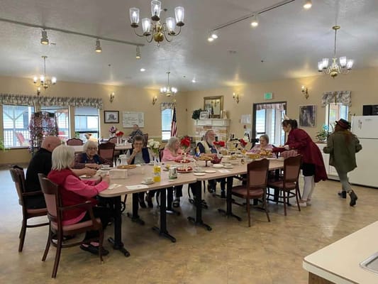 Residents enjoying a meal together in the dining area
