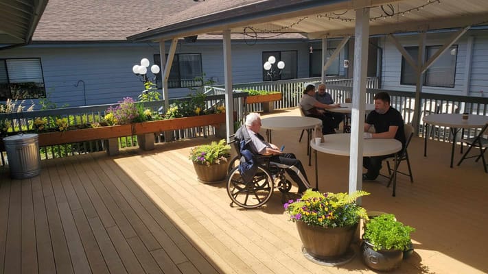 Residents enjoying an outdoor space on a sunny day