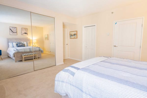 Well-decorated resident bedroom with mirror