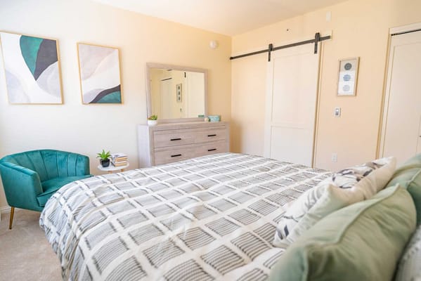 Brightly decorated private resident room with bed and decor