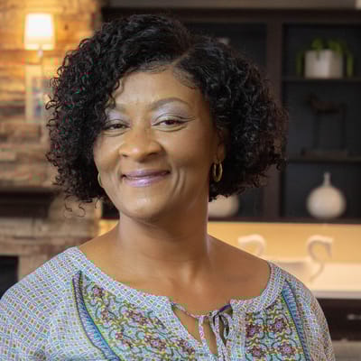 Smiling staff member in a welcoming interior