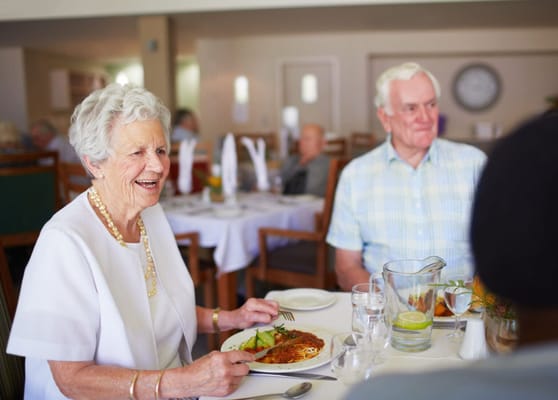 Residents enjoying a meal together in a dining area