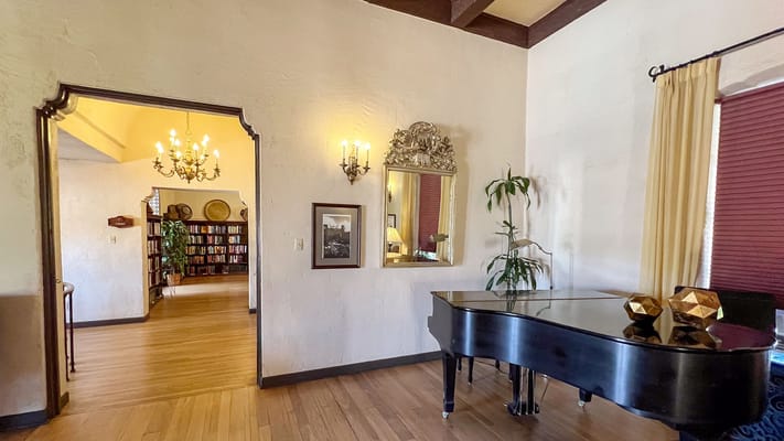 Interior view of a common area with a grand piano