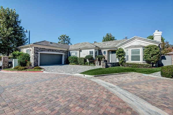 Exterior view of a senior living facility with landscaped gardens