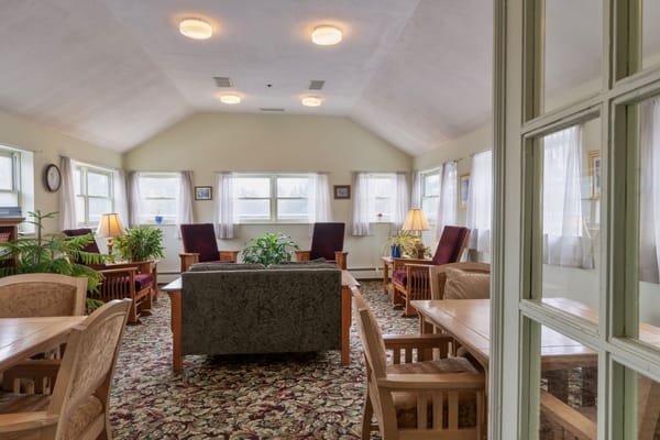 Interior view of a common area with seating and plants