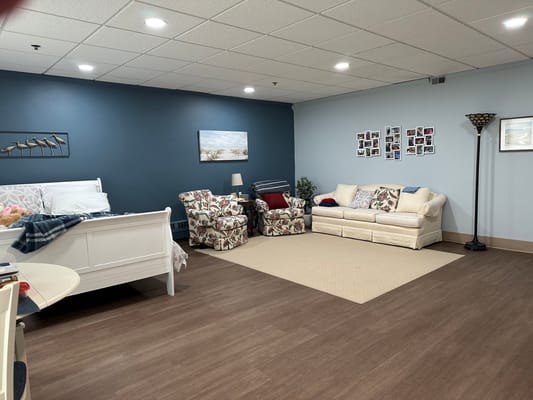 Bright private resident room with seating area