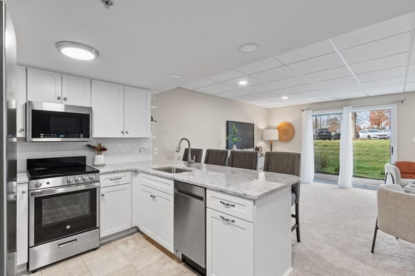 Modern kitchen area with natural light and exterior view