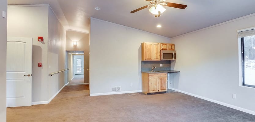 Interior view of a resident room with kitchenette