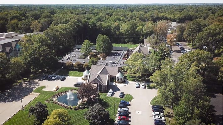 Aerial view of Manoogian Manor with surrounding greenery