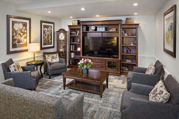 Cozy common area with seating and a TV