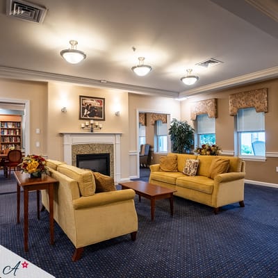 Cozy common area with comfortable seating and a fireplace