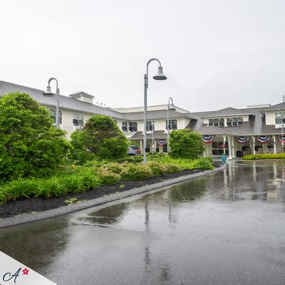 Exterior view of a senior living facility with landscaping