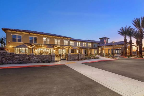 Exterior view of Oakmont of Riverpark at sunset