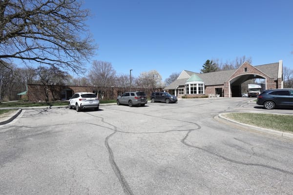 Exterior view of Manoogian Manor entrance and parking area