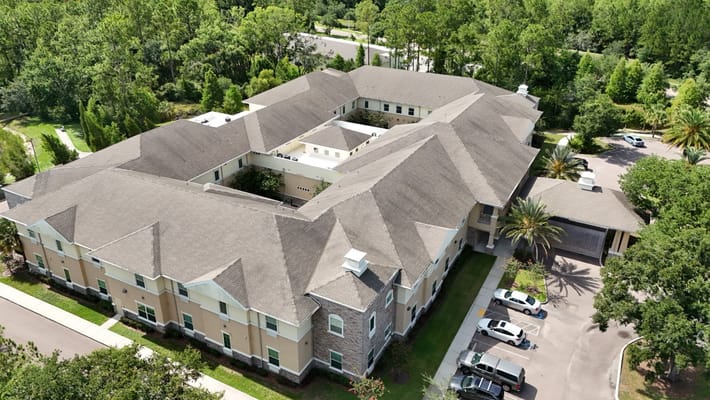 Aerial view of the assisted living facility surrounded by greenery