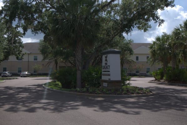 Front entrance sign of The Legacy at Highwoods Preserve