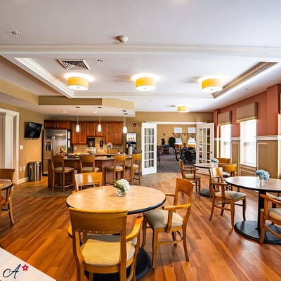 Bright dining area with tables and chairs