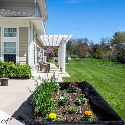 Garden area beside a modern assisted living facility