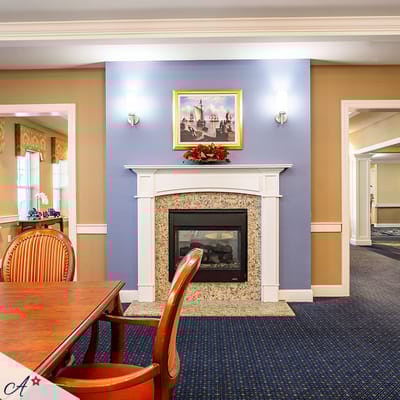 Cozy common area with a fireplace and dining table