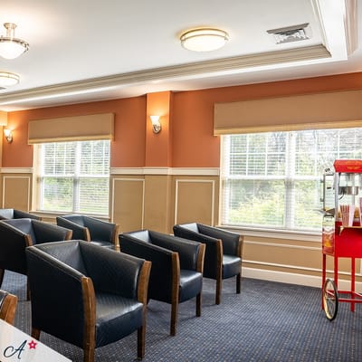Interior common area with seating and popcorn machine