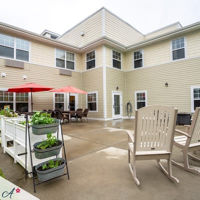 Outdoor patio area with seating and planters