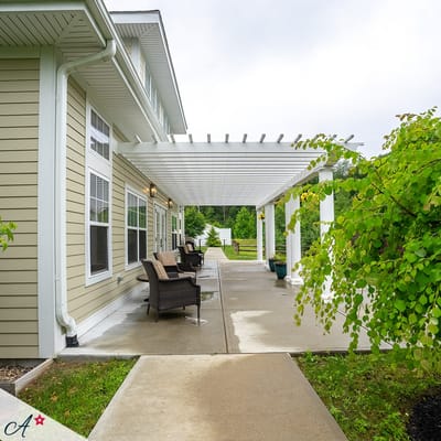 Covered outdoor patio area with seating