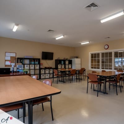 Bright common area with tables and chairs