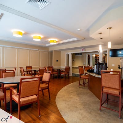 Dining area with tables and chairs in a bright interior