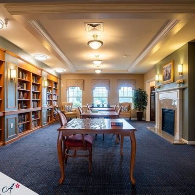 Bright common area with bookshelves and seating