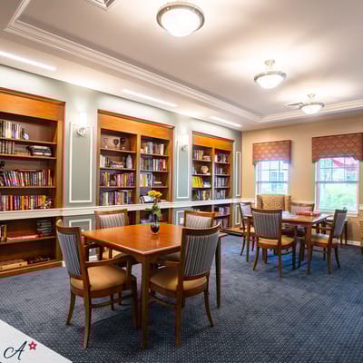 Cozy library area with bookshelves and seating