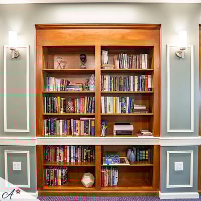 Well-stocked bookshelf in a common area